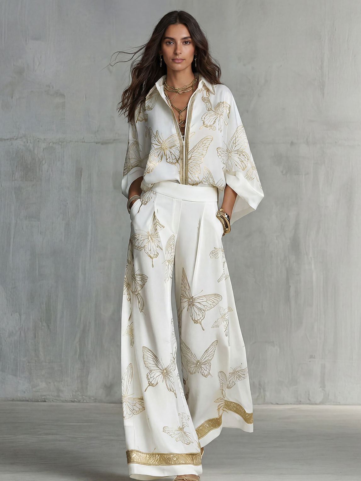 CELIA - Set top zip con farfalle e pantaloni wide leg
