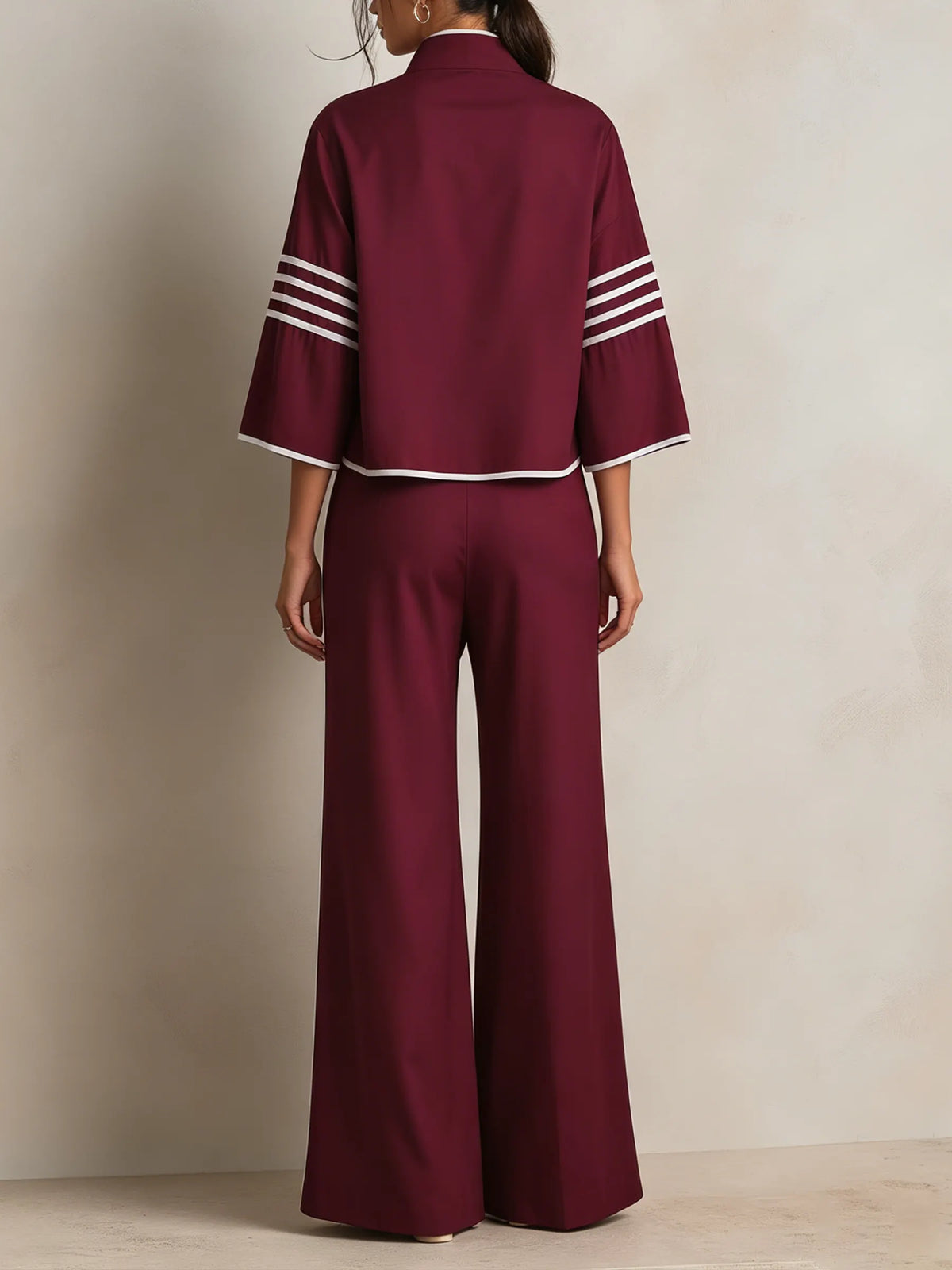 CREMELLA - Completo bordeaux con top asimmetrico e pantaloni ampi