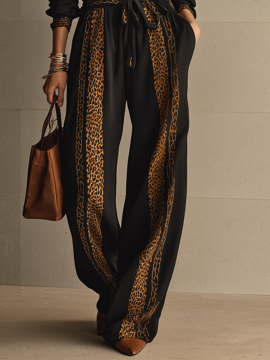 MINUCCIANO - Jumpsuit nero leopardato con cintura in vita
